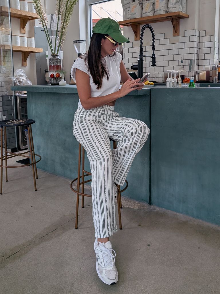 Parce Green Linen Pant styled casually at a coffee bar – white linen pants with green stripes and sneakers