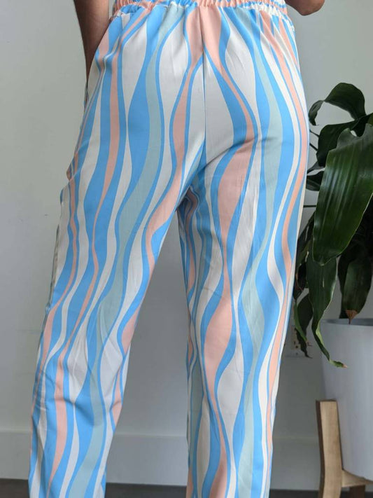 Woman wearing Blue Flow Pant – breathable soft pant with tropical blue design