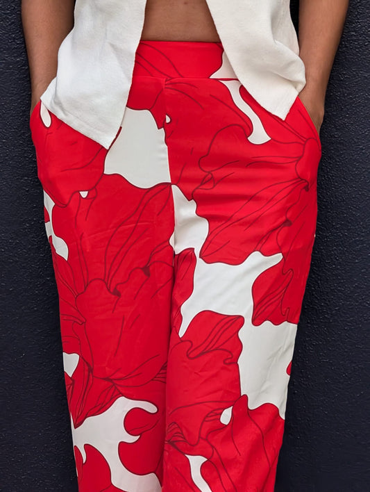 Woman wearing Mallow Pant – soft red tropical mango silk trousers, ethically made