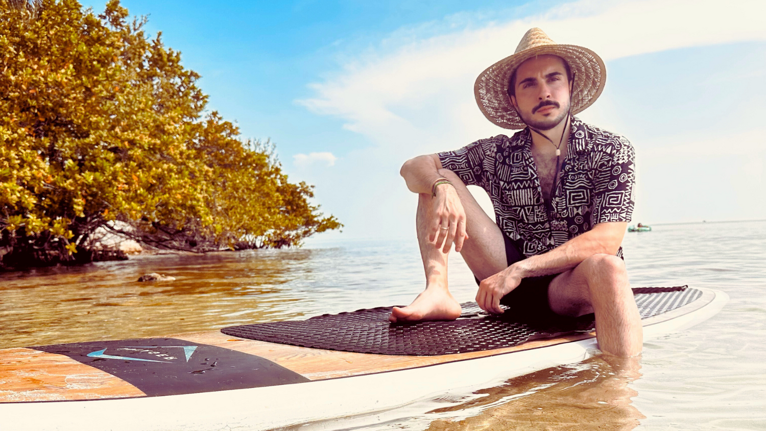 Man wearing a Parce shirt on a kayak 
