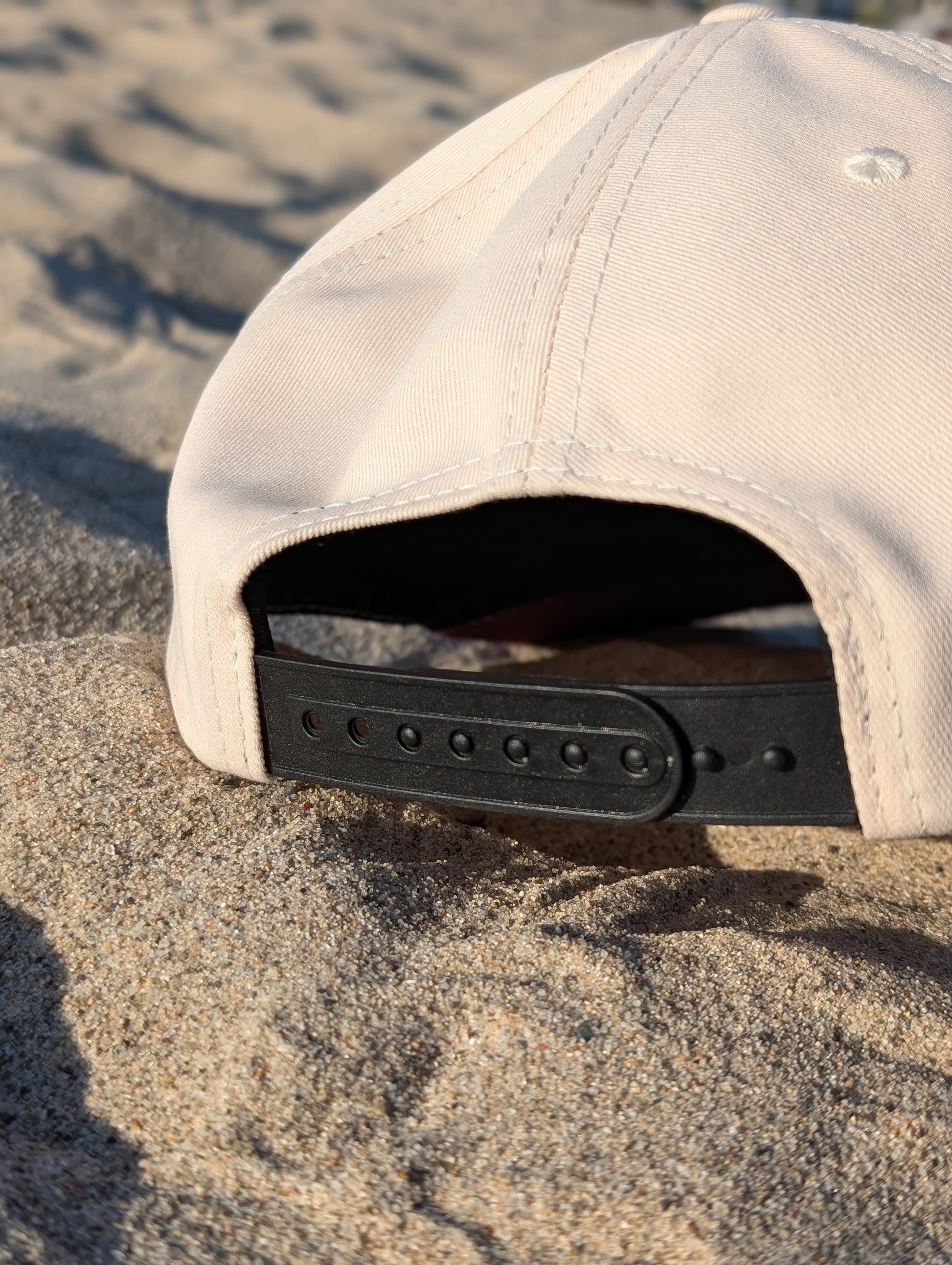 Rear view of white Parce Miami cap featuring adjustable strap and Parce branding