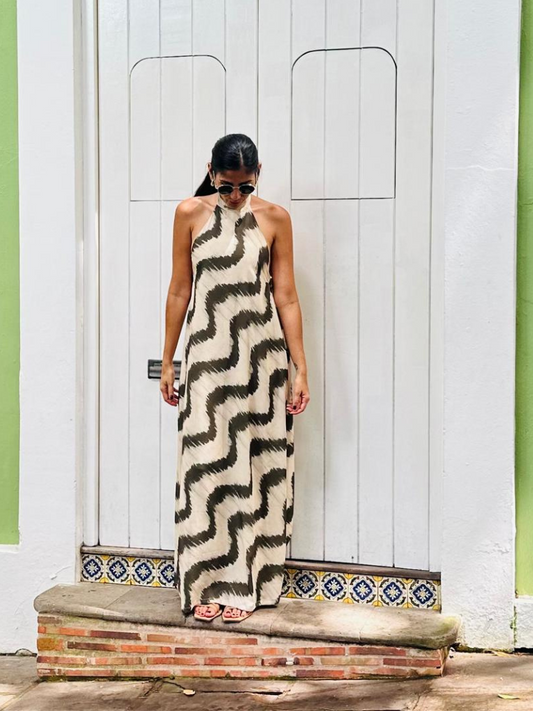 Woman in floor-length San Juan Maxi Dress standing in front of white colonial doors in Old San Juan