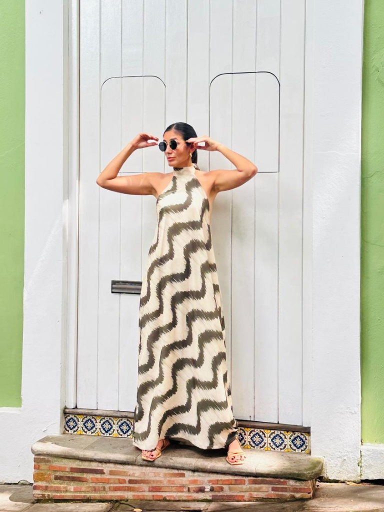 Woman in floor-length San Juan Maxi Dress standing in front of white colonial doors in Old San Juan