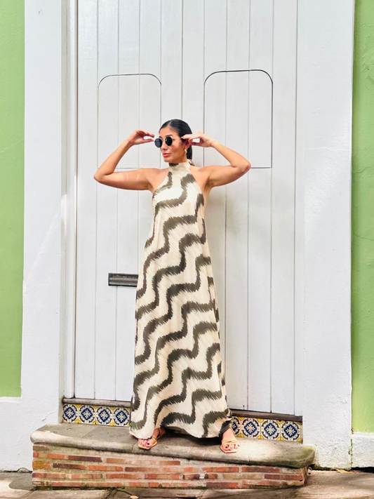 Woman in floor-length San Juan Maxi Dress standing in front of white colonial doors in Old San Juan